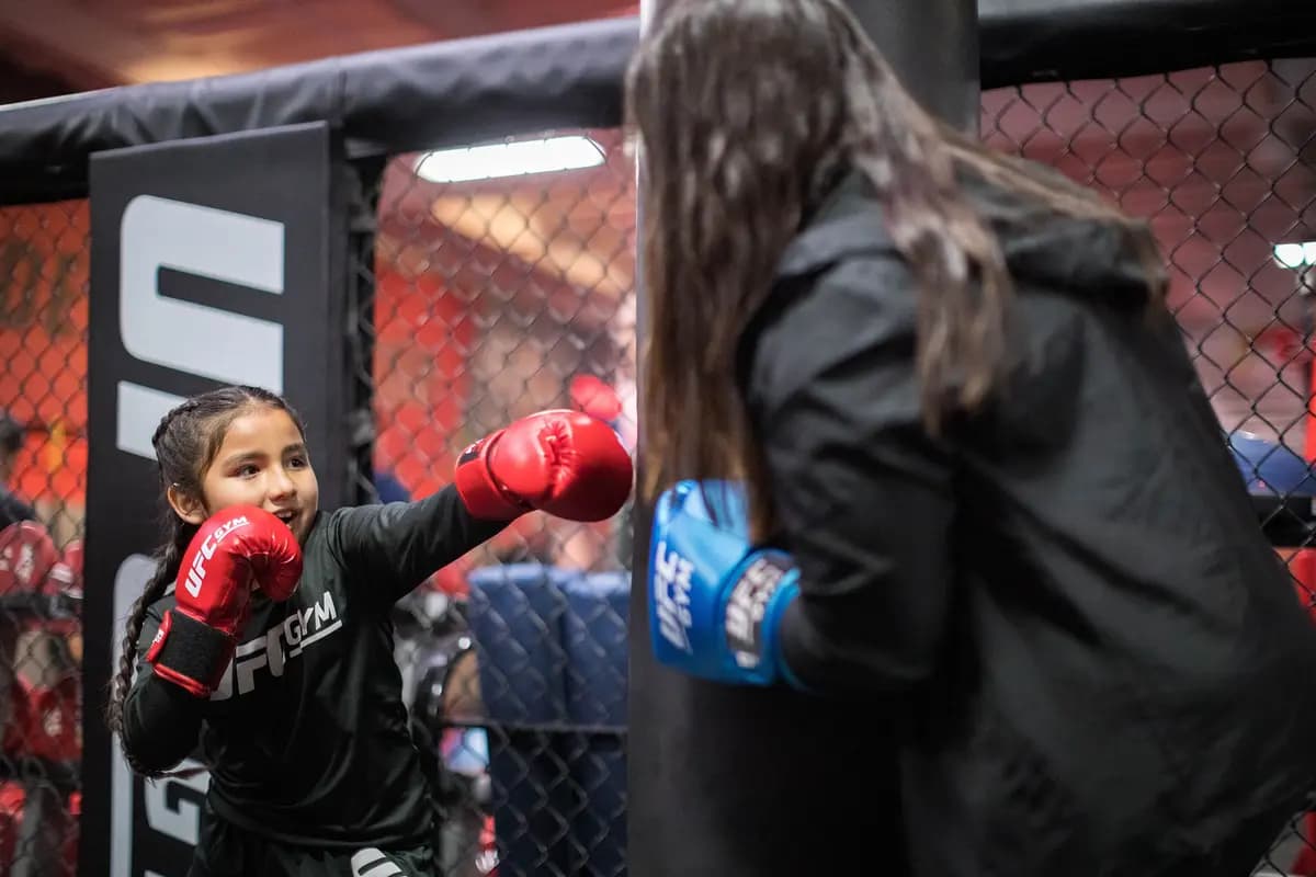 Young member punching a bag